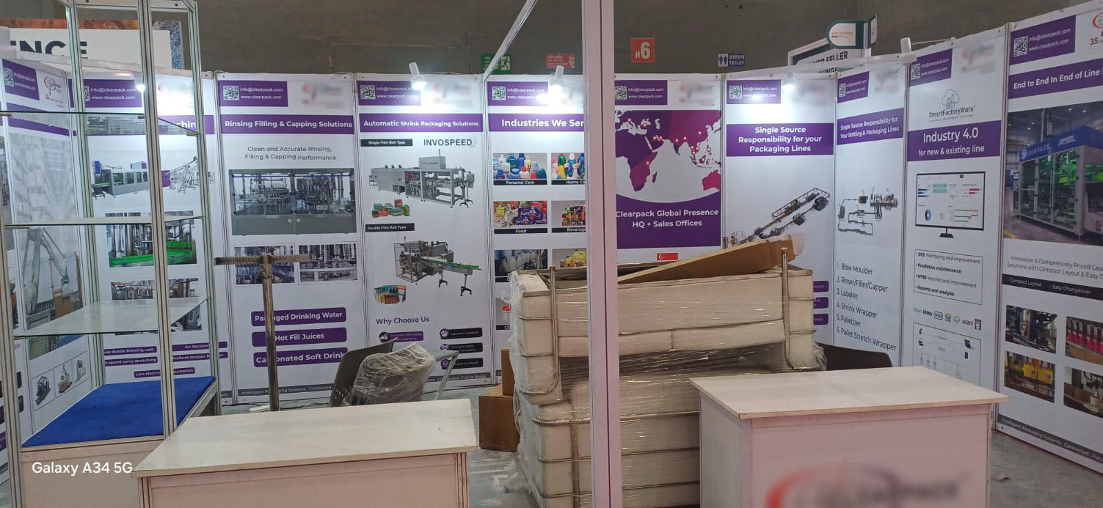 Packaging automation exhibitor — multi-panel vinyl branding on octonorm — Exhibition Prints