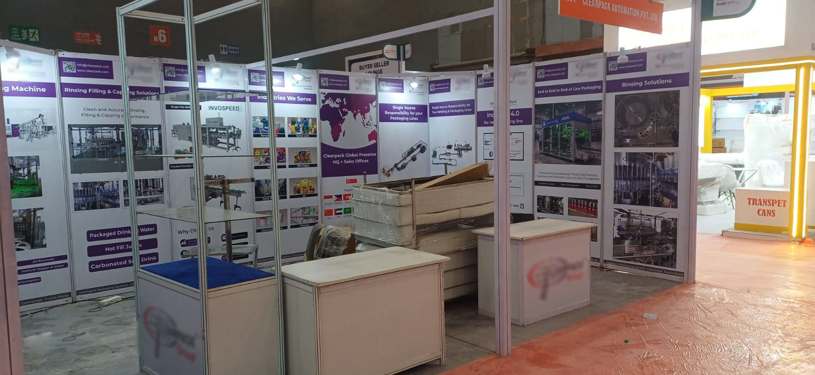 Aisle view during build-up — packaging machinery exhibitor vinyl panels — Exhibition Prints