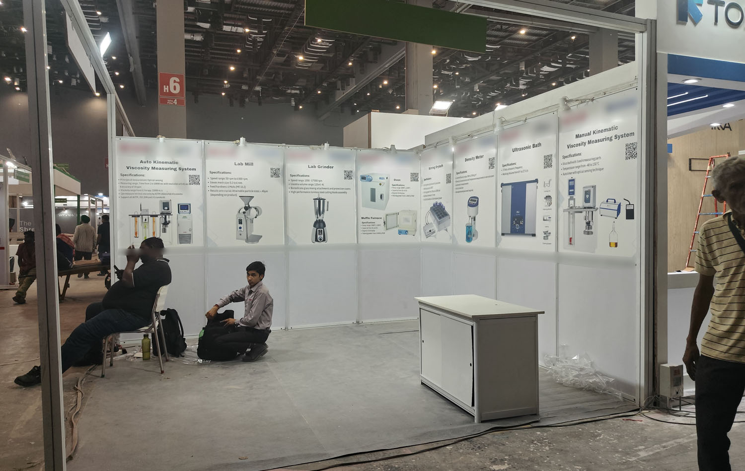 Laboratory equipment stall — panel-per-product vinyl layout — Exhibition Prints